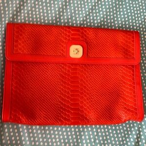 Longchamp orange leather clutch